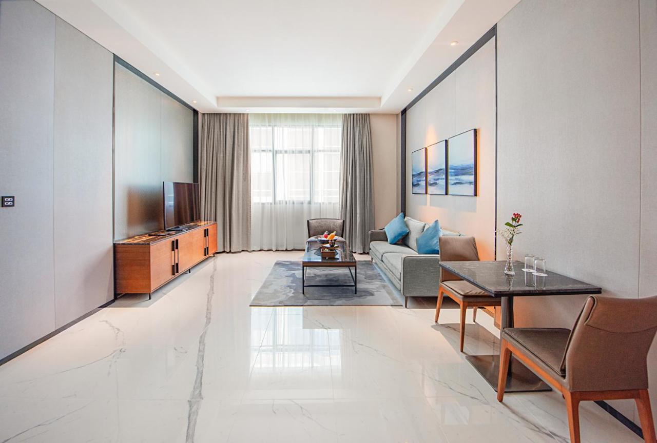 Asiana Grand Hotel دبي المظهر الخارجي الصورة A living room in a serviced apartment in Beijing, China